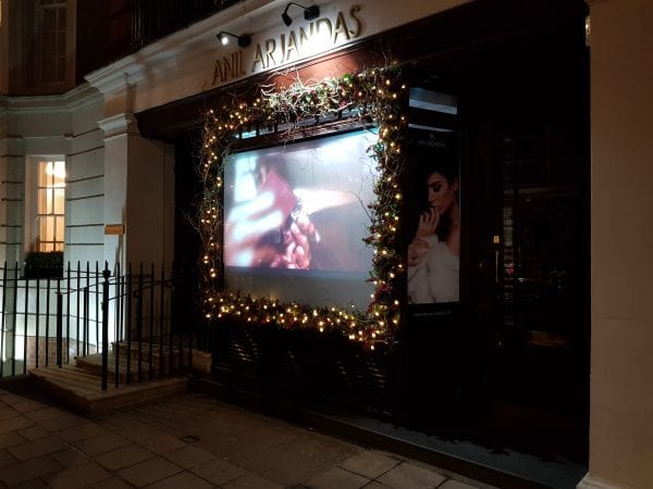 Anil Arjandas enjoy the projection, privacy and security advantages of using a Switchable Projection Screen in their window display Anil Arjandas enjoy the projection, privacy and security advantages of using a Switchable Projection Screen in their window display